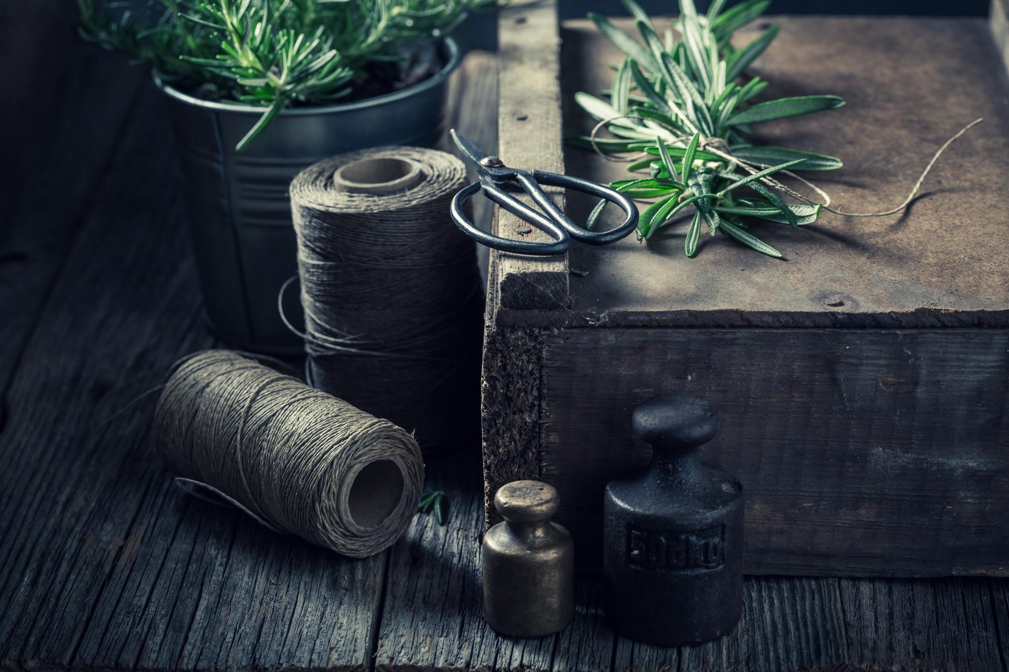 studio table with threads and sketches